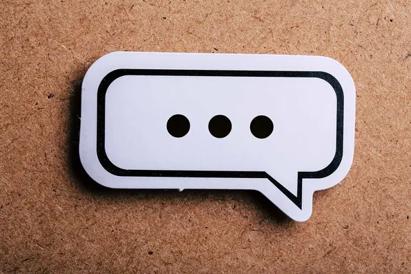 A sticker showing a speech bubble emoji with three dots indicating a pause displayed inside